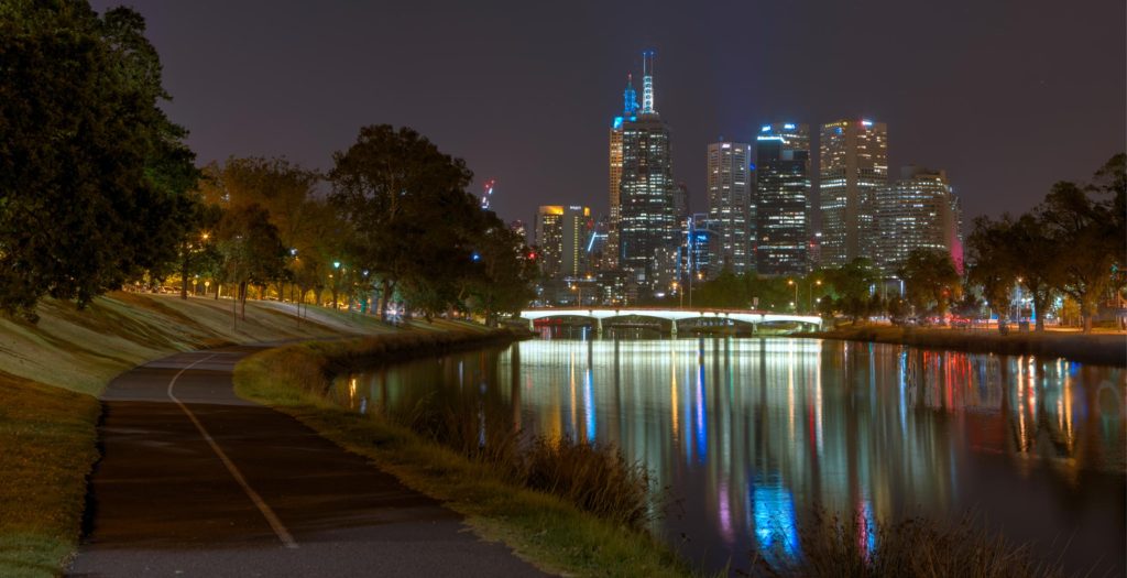 melbourne city behind the yarra river at night